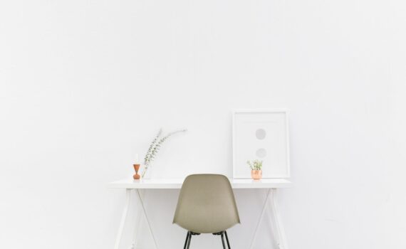 beige and black chair in front of white desk
